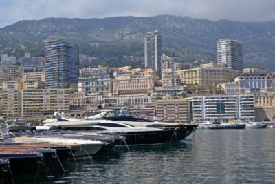 luxury yachts in harbor in monte carlo and view on a city