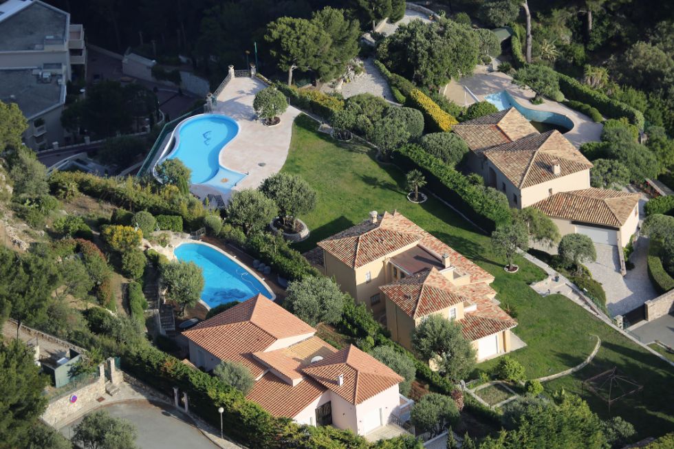aerial view of luxurious houses and pools